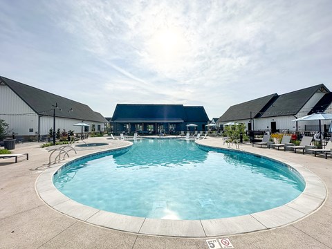 a swimming pool at the resort on a sunny day at The BLVD at Wilson Crossings, Wyoming, MI 49418